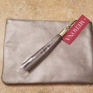 Pewter metallic clutch with tassel